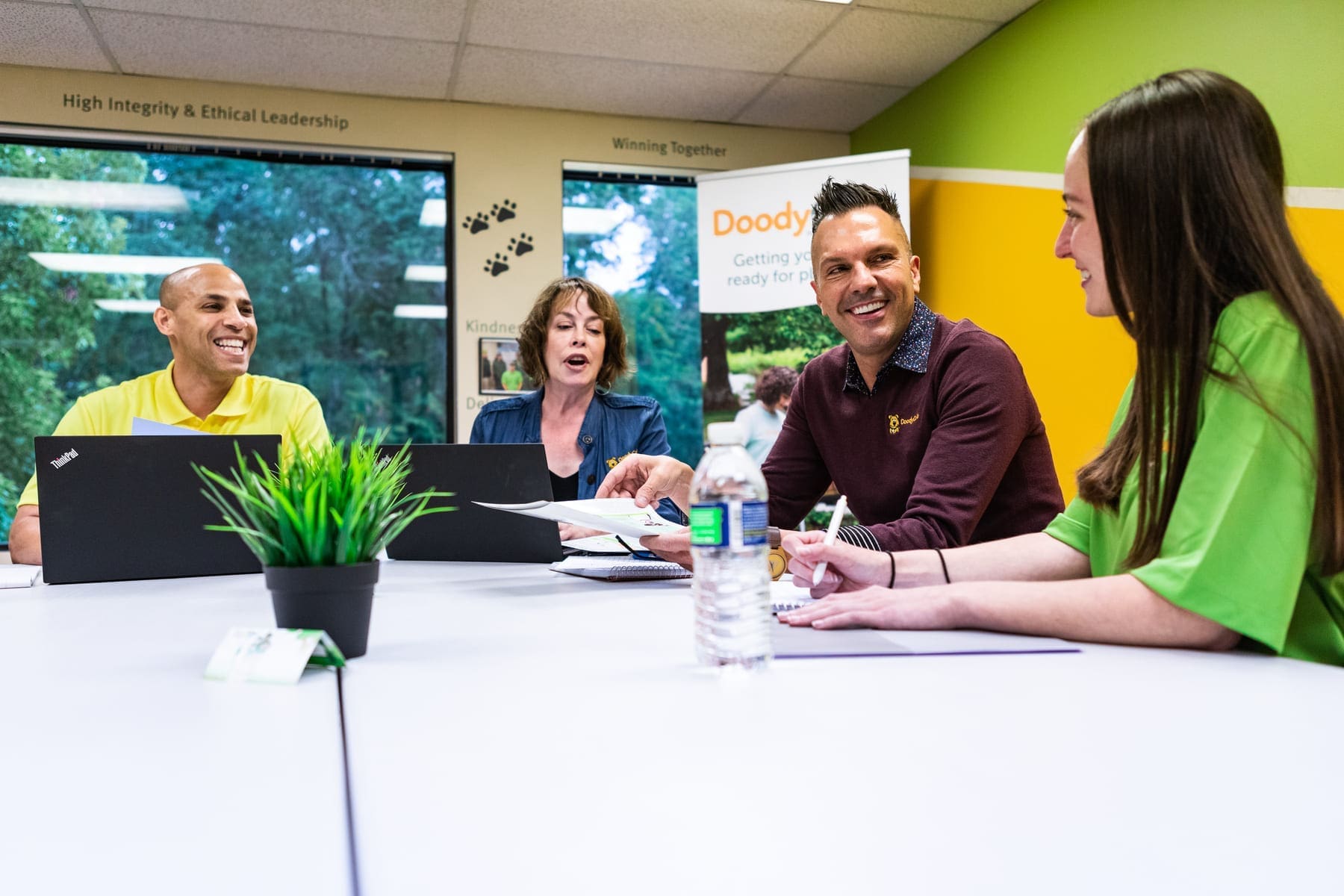 DoodyCalls team collaborating in meeting room 